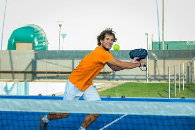 Portrait of tennis player playing on tennis court