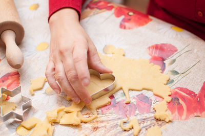 High angle view of woman preparing food on table