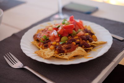 Close-up of fresh food served in plate on table at restaurant