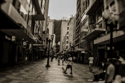 People walking on street in city