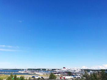 High angle view of buildings against blue sky