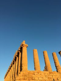 Low angle view of historical building against blue sky