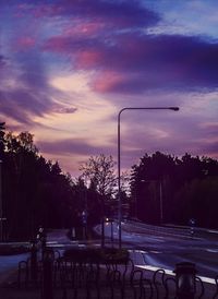 Road against cloudy sky at dusk