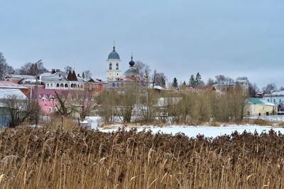 Panoramic shot of building against sky during winter