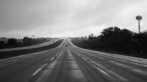 Empty road against sky