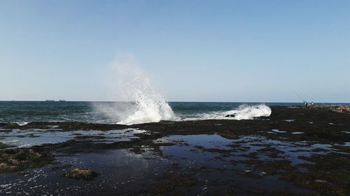 Scenic view of sea against clear sky