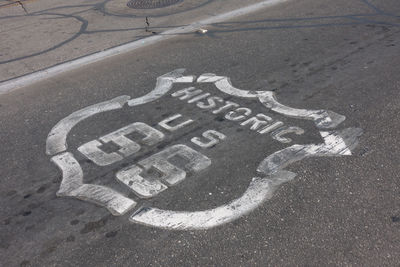 High angle view of road sign on street