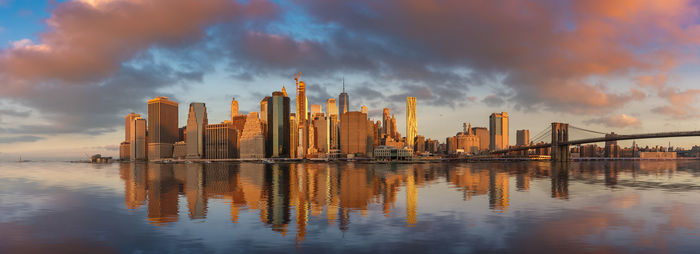 Panoramic view of river and buildings against sky