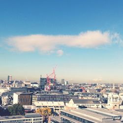 View of cityscape against blue sky