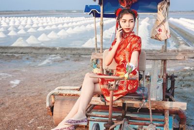 Portrait of woman sitting on seat