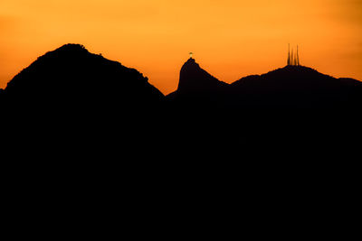 Silhouette mountain against sky during sunset