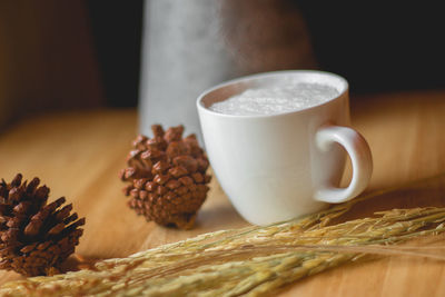 Close-up of coffee cup on table