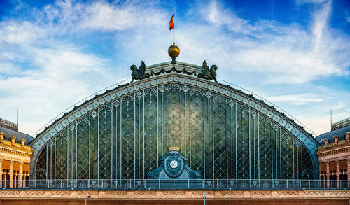 Low angle view of historical building against cloudy sky