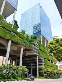 Low angle view of modern buildings against sky