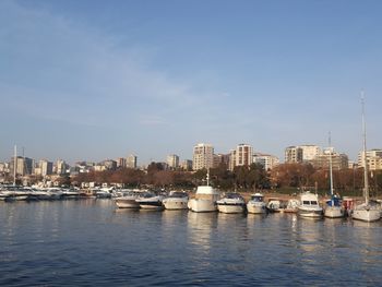 Boats in sea against sky