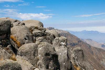 Rocks in mountains against sky