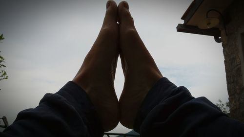 Low angle view of people against sky