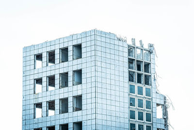 Low angle view of modern building against clear sky