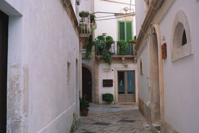 Alley amidst buildings in city