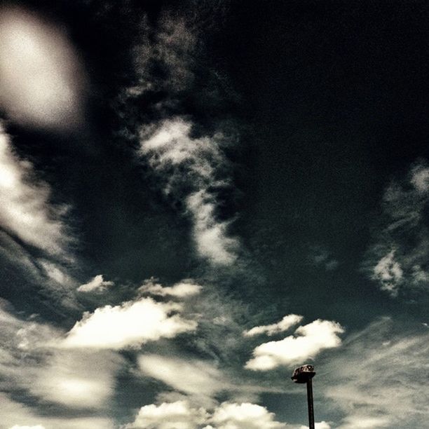 low angle view, sky, cloud - sky, street light, cloudy, lighting equipment, cloud, high section, nature, silhouette, outdoors, no people, weather, overcast, dusk, pole, beauty in nature, tranquility, day, blue