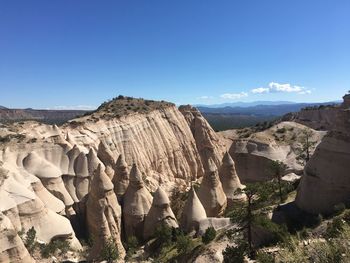 Panoramic view of rock formations against sky