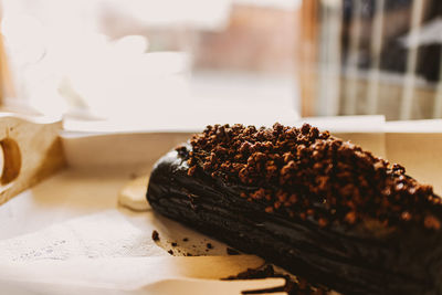 Dark chocolate bread with white creamy custard in a cafe.