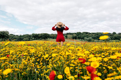 Full length of woman standing on field