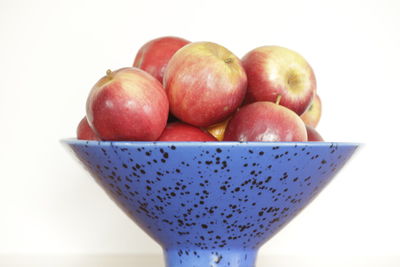 Close-up of fruits over white background