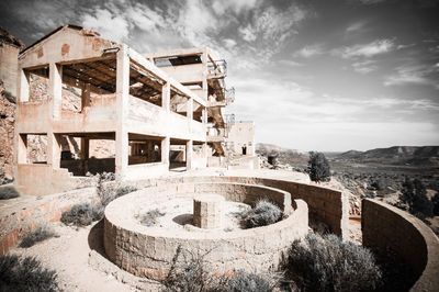 Old ruin building against cloudy sky