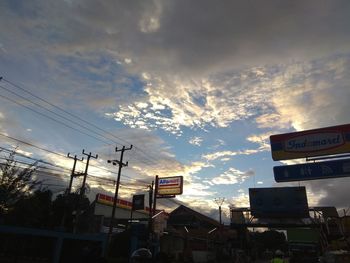 Low angle view of city against sky during sunset