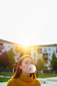 Portrait of woman against clear sky