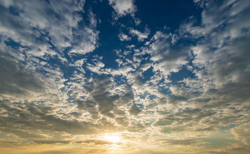 Low angle view of dramatic sky during sunset