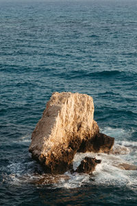 High angle view of rock formation in sea