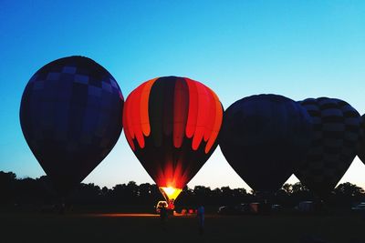 Multi colored hot air balloon against clear blue sky