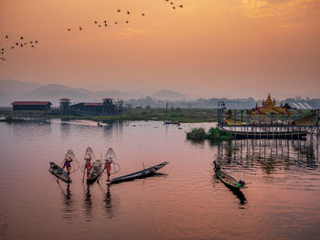 Scenic view of lake against sky during sunset