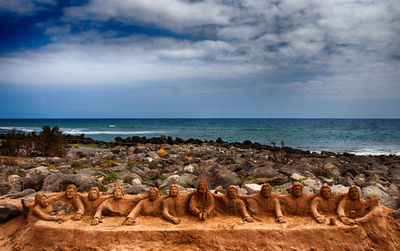 Scenic view of sea against cloudy sky