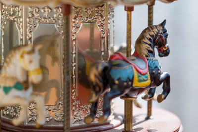 Close-up of carousel horses in amusement park