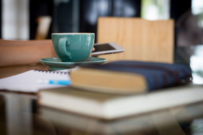 Close-up of coffee cup on table