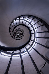 Look up to a spiral staircase