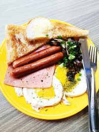 High angle view of breakfast in plate on table