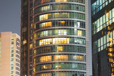 Low angle view of modern buildings at night