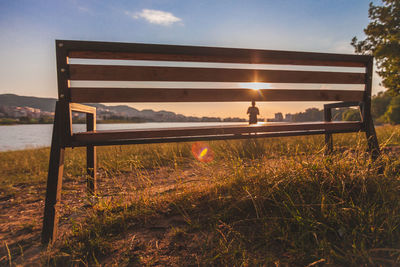 Built structure on field against sky during sunset