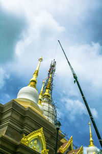 Low angle view of statue against sky