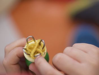Close-up of hand holding leaf