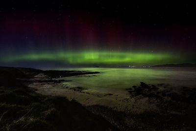 Scenic view of sea against sky at night