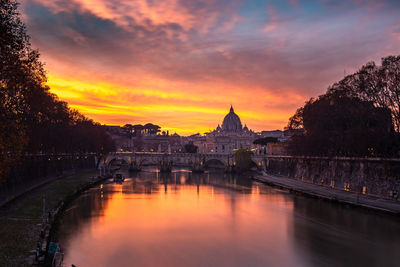 Bridge over river during sunset