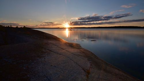 Scenic view of sea against sky at sunset