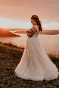 Young woman standing on field