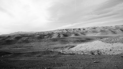 Idyllic shot of sand dunes in desert against sky