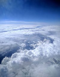 Aerial view of landscape against cloudy sky